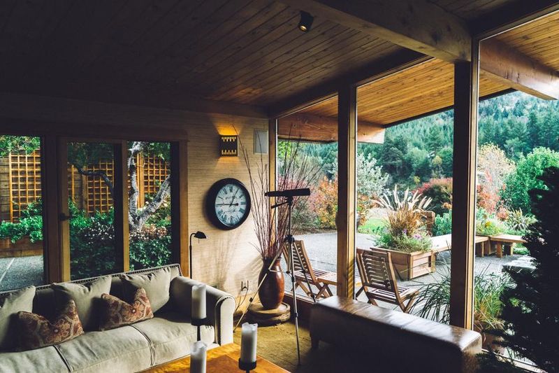 Wood-panelled sunroom opening onto a garden, enhanced sample frame.
